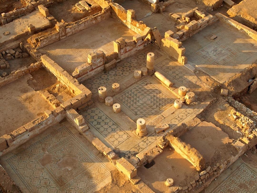 Ancient Ptolemais archaeological site in Libya showing excavated structures and mosaic floors